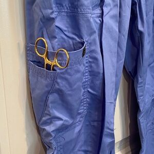 Women’s blue scrub pants by KOI. Multiple pockets, comfy! Elastic waist.